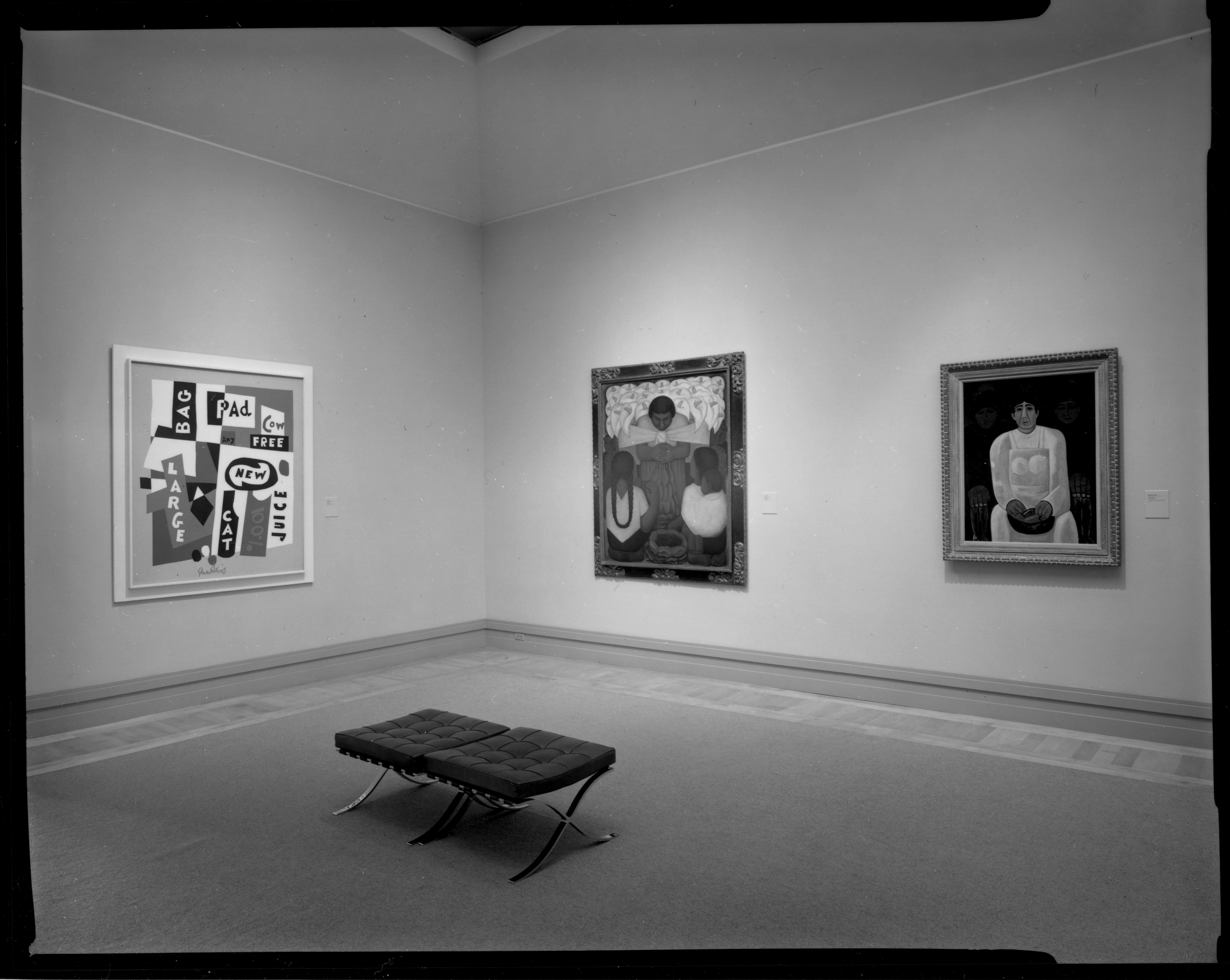 Black and white photograph of gallery with paintings on walls