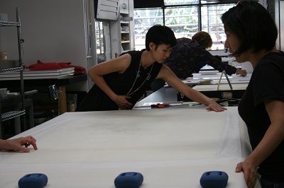 Pre-program Intern, Jacklyn Chi, preparing the print for drying.