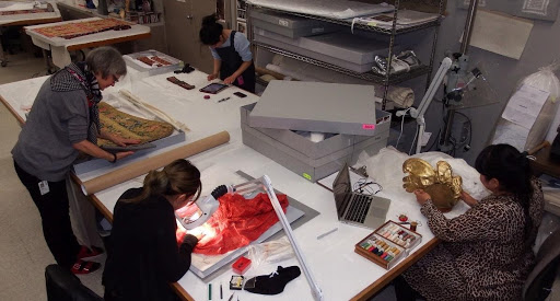 Textile conservators busy stabilizing pieces from the LACMA collection, photo by Catherine McLean