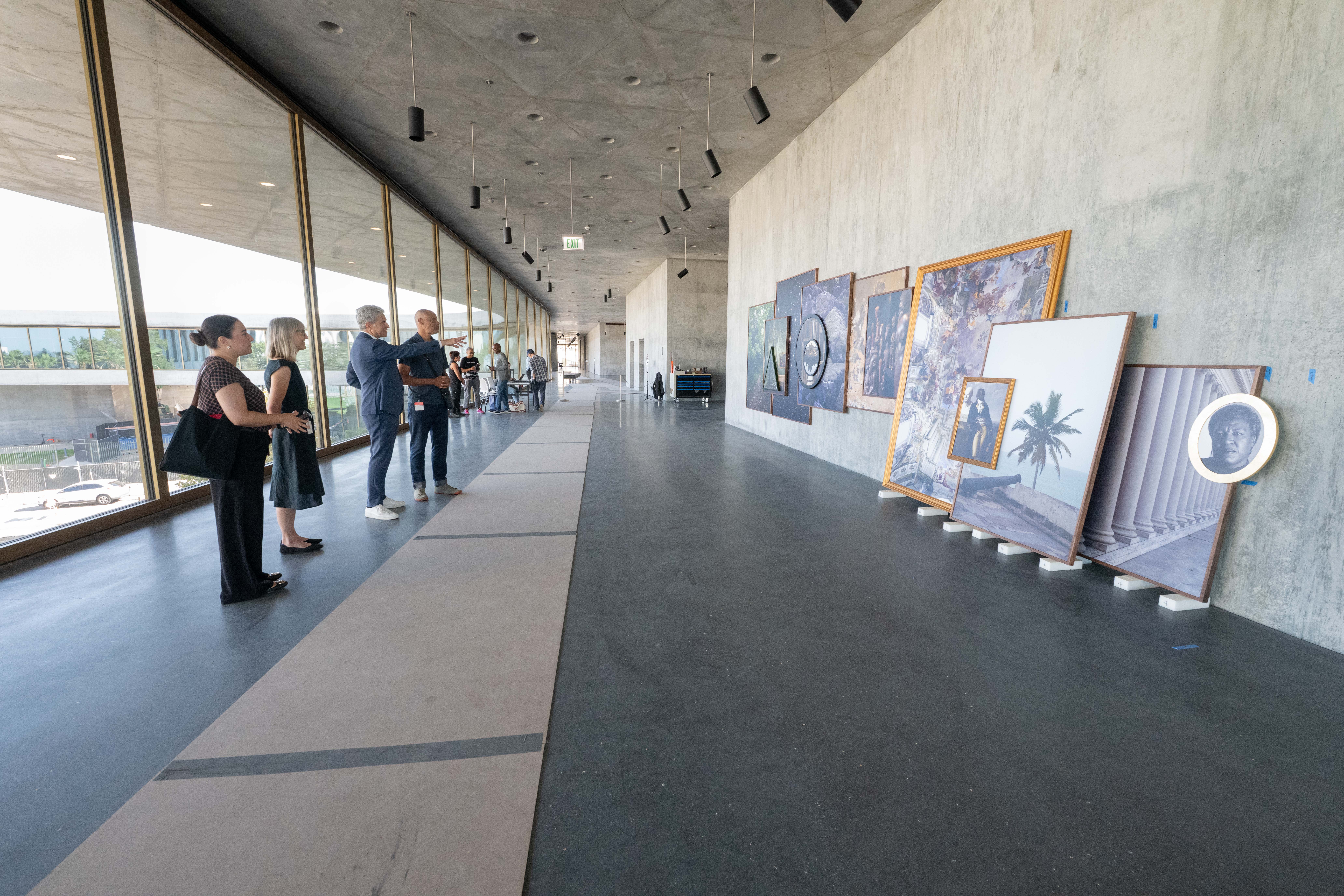 Deliasofia Zacarias, curator Britt Salvesen, LACMA director Michael Govan, Todd Gray, and members of the installation team during the installation of Octavia's Gaze, 2025, Los Angeles County Museum of Art, gift of the 2024 Collectors Committee, photo © Museum Associates/LACMA