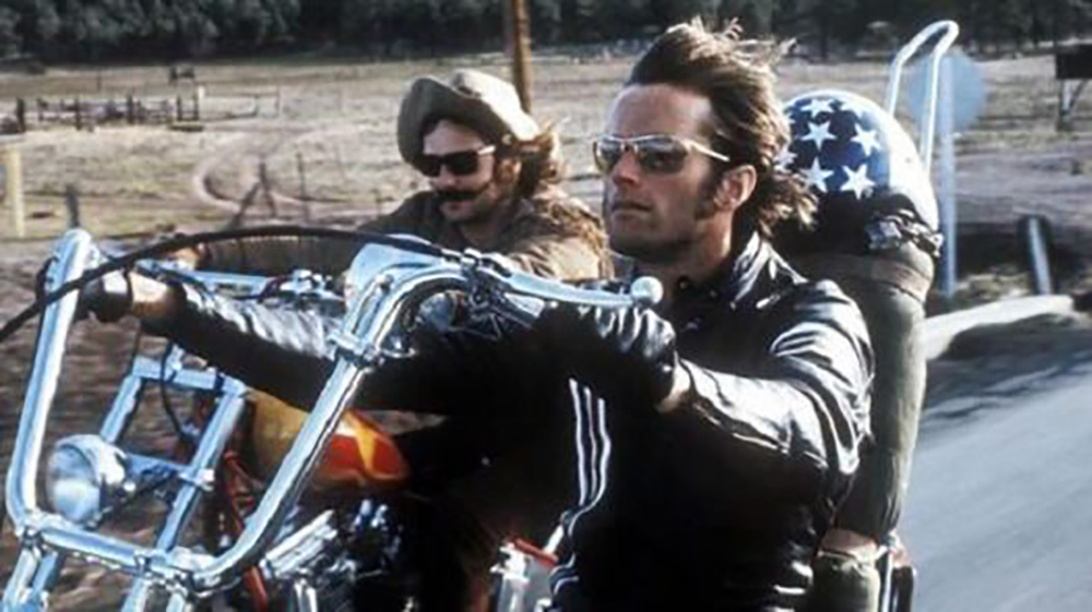Two men riding motorcycles