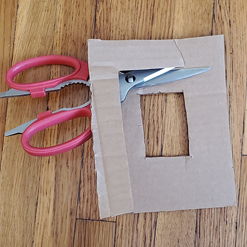 cutting out a cardboard frame