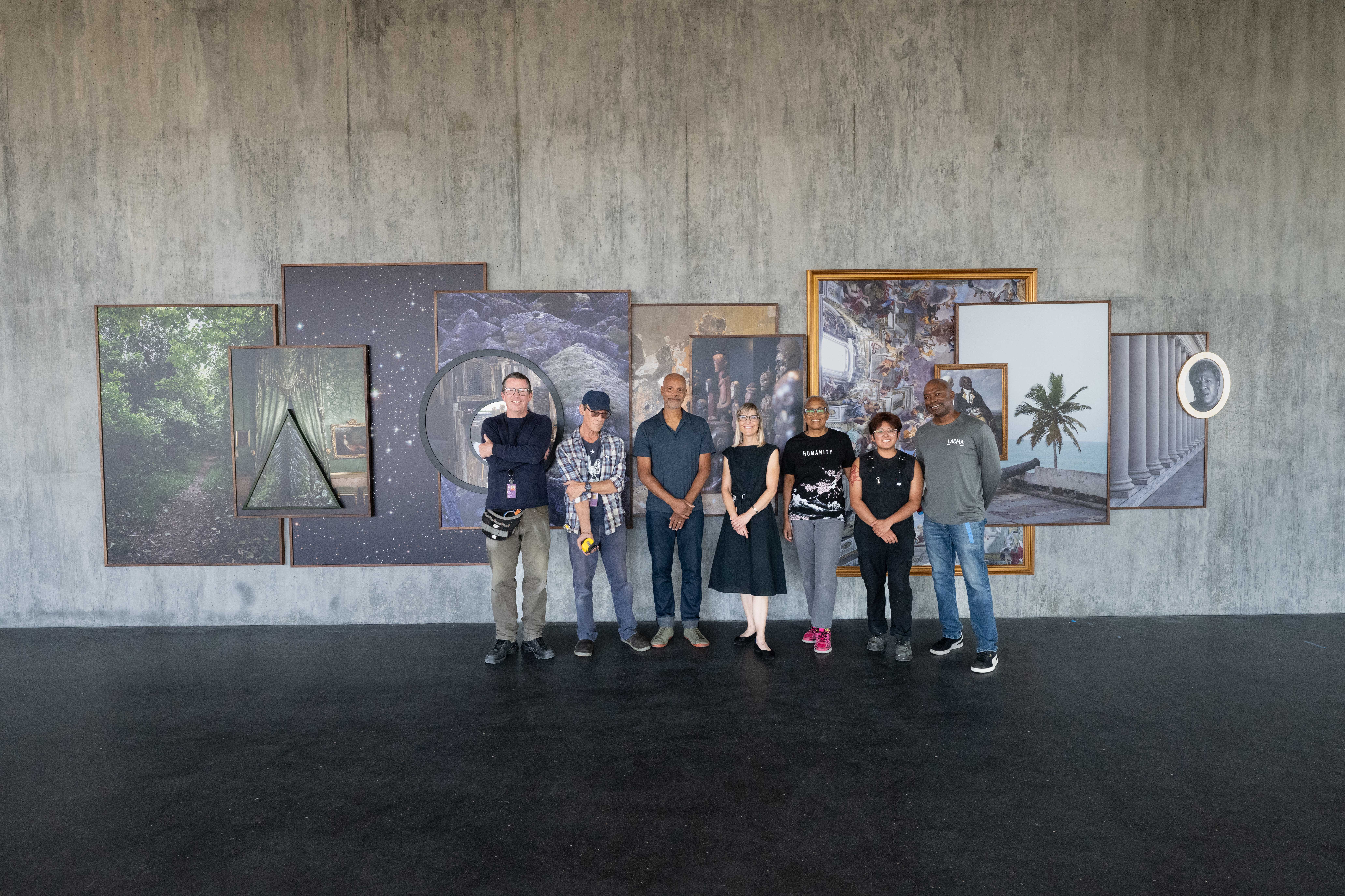 Todd Gray and curator Britt Salvesen with members of the installation team during the installation of Octavia's Gaze, 2025, Los Angeles County Museum of Art, gift of the 2024 Collectors Committee, photo © Museum Associates/LACMA