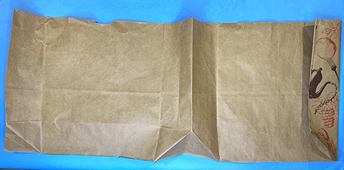 brown paper grocery bag cut open and laid out flat