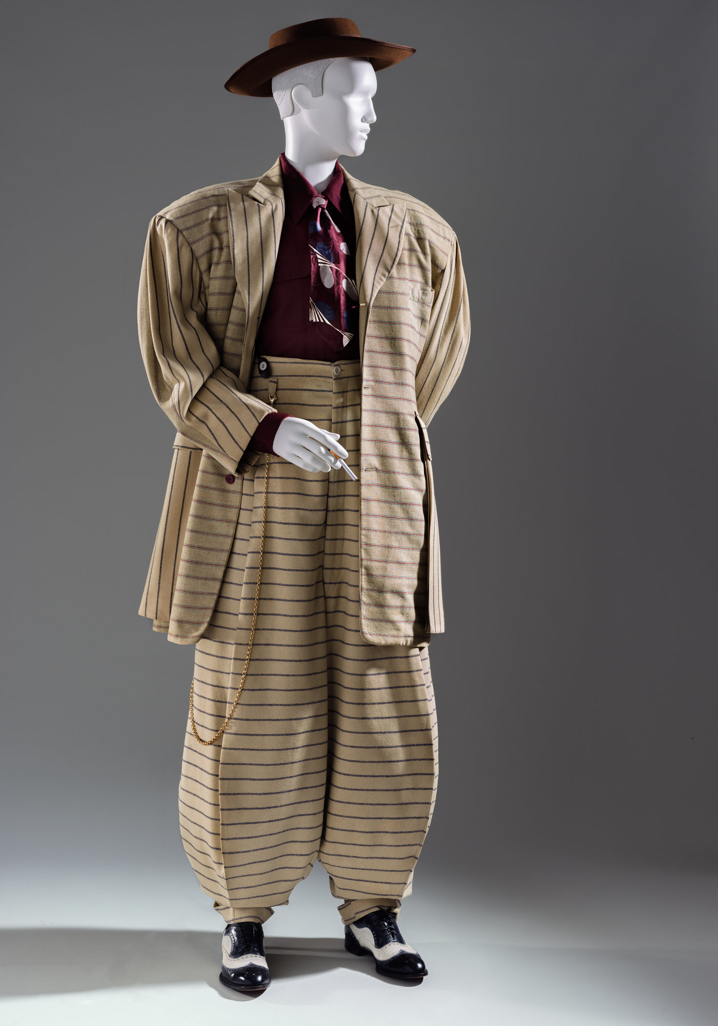 Zoot Suit, United States, 1940–1942, Los Angeles County Museum of Art, purchased with funds provided by Ellen A. Michelson; Necktie (Belly-warmer), United States, c. 1945, Los Angeles County Museum of Art, gift of Stephen J. and Sandra Sotnick; Shoes (Spectators), United States, 1935–42, Los Angeles County Museum of Art, gift of Mrs. Carl W. Barrow