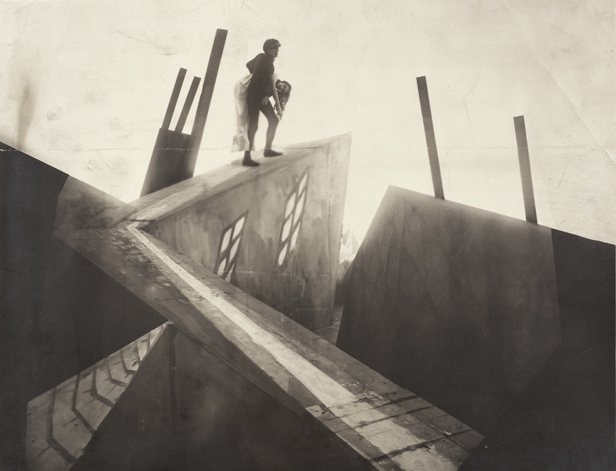 Unknown German Artist, Untitled (Cesare [Conrad Veidt] Carrying Jane [Lil Dagover] across Rooftops), 1919, set photograph from the film Das Cabinet des Dr. Caligari (The Cabinet of Dr. Caligari), The Robert Gore Rifkind Center for German Expressionist Studies