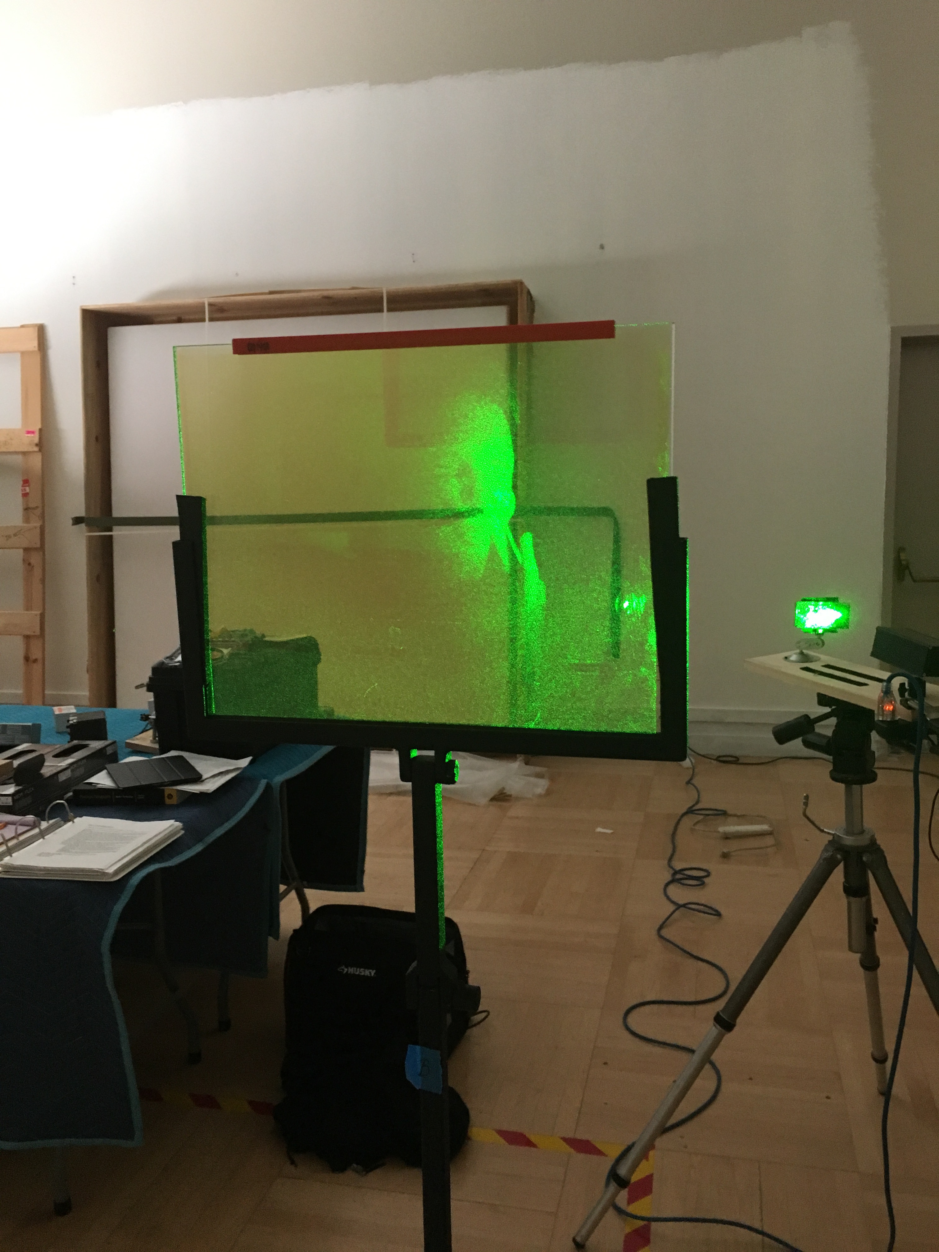 During a test with James Graham, the beam from the diode laser is reflected into a mirror, in order to illuminate the hologram from behind. Photo courtesy of Zoe Blackwell, 2018