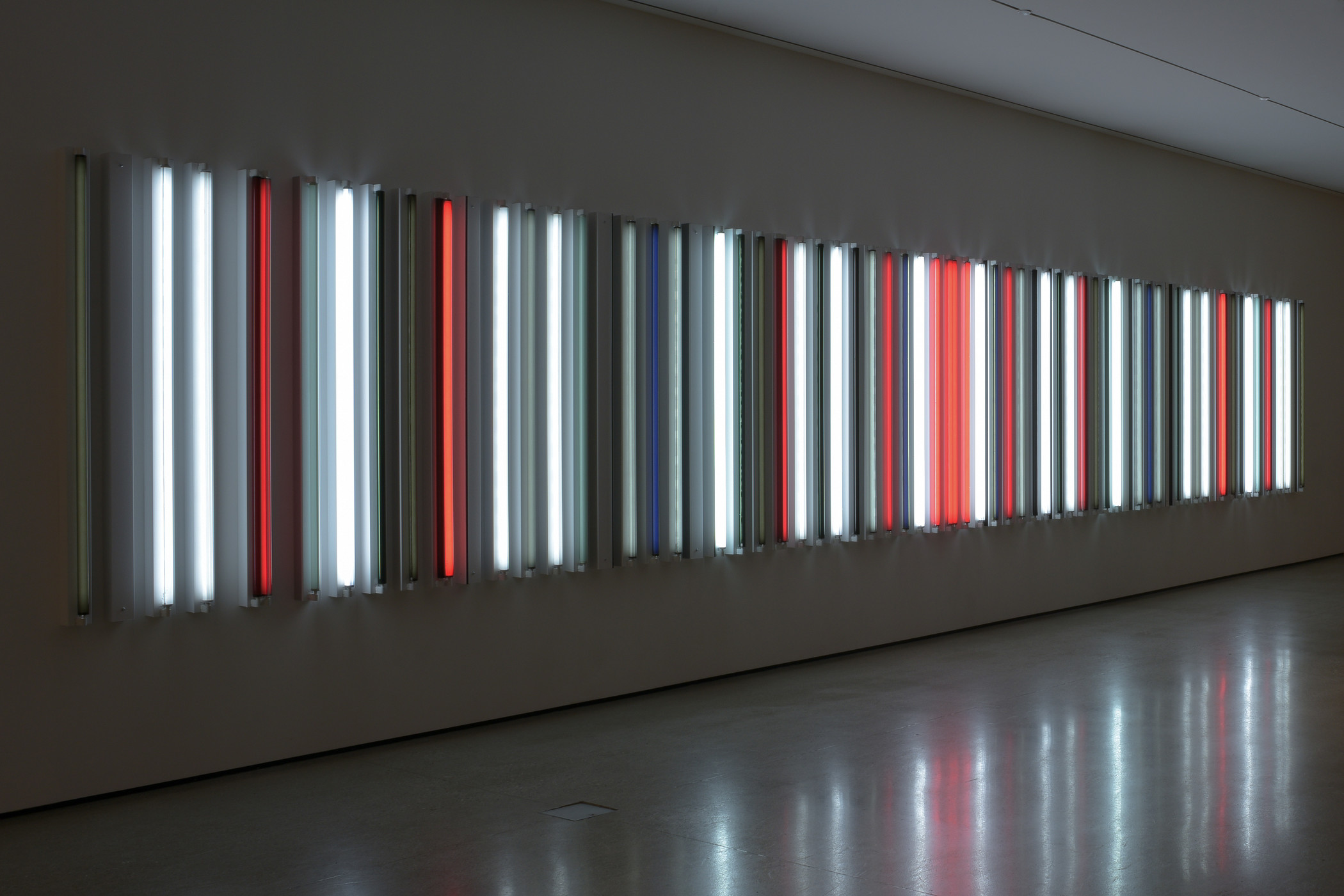 Glowing red, white, blue neon tubes comprising an artwork