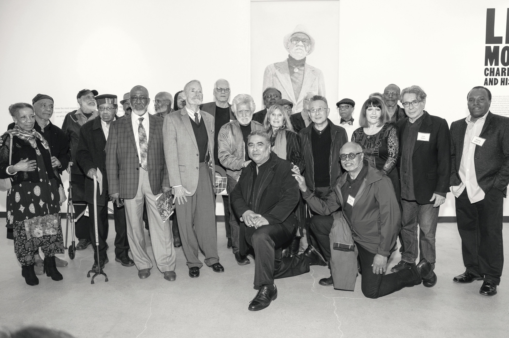 C. Ian White (center, on one knee) with Charles White’s students at the opening of Life Model, February 16, 2019, photo by John Sciulli