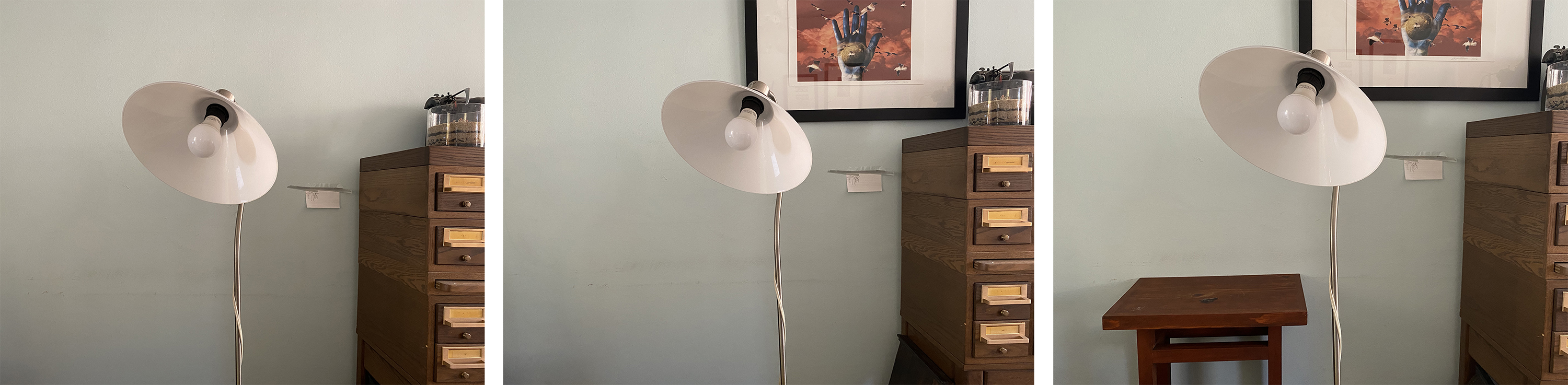 image of a wall with a lamp in front; image of the same wall with a lamp and now a picture is hanging on the wall; image of same space and now a small table is in frame