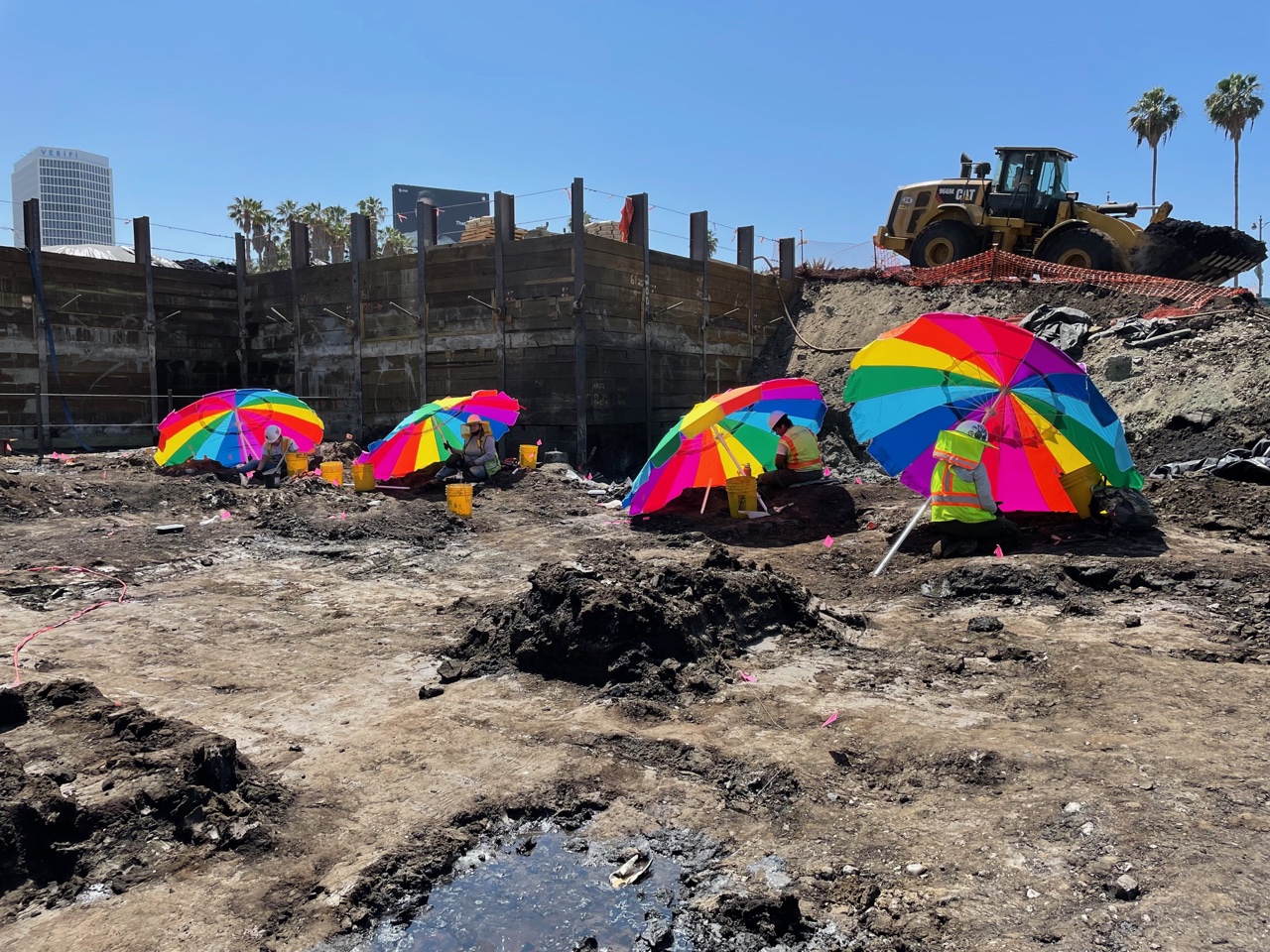 View of construction site with colorful umbrellas
