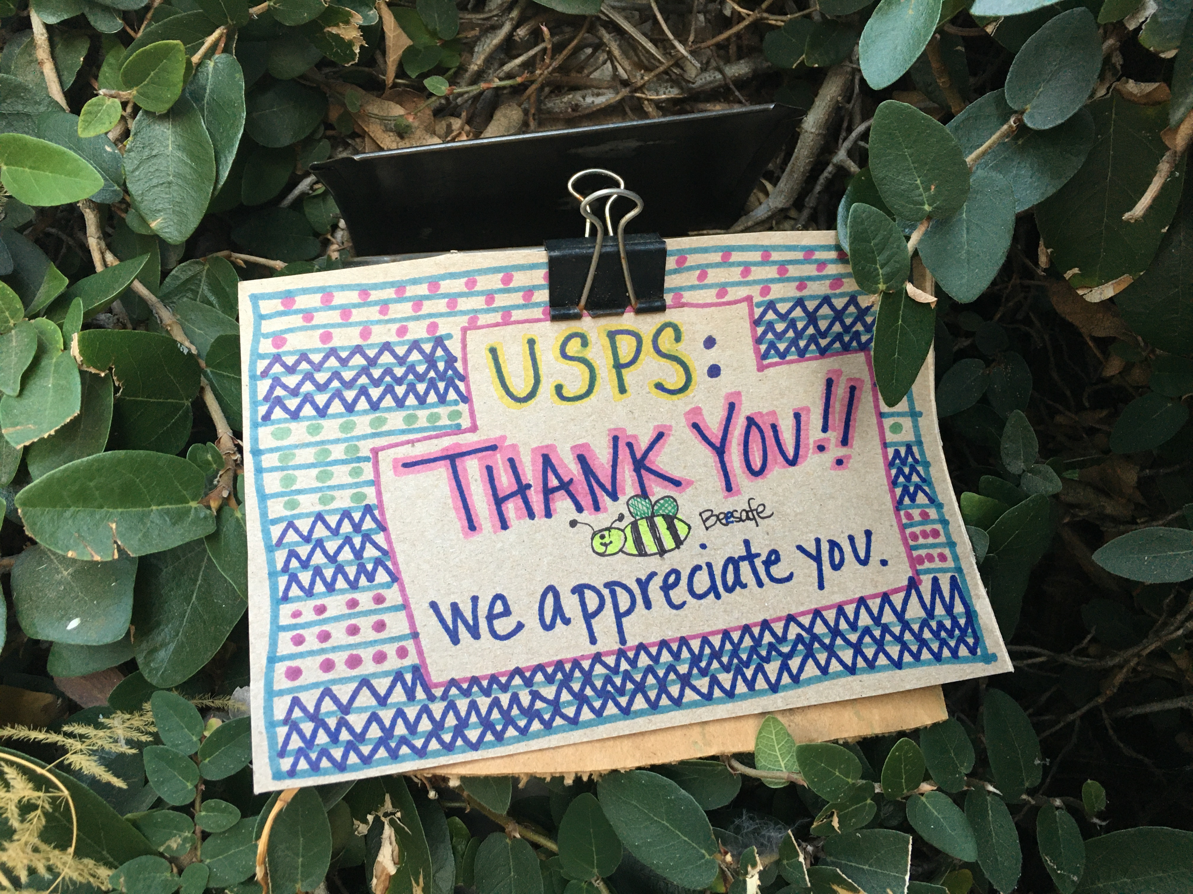 sign reading USPS: Thank you! Bee safe, we appreciate you.