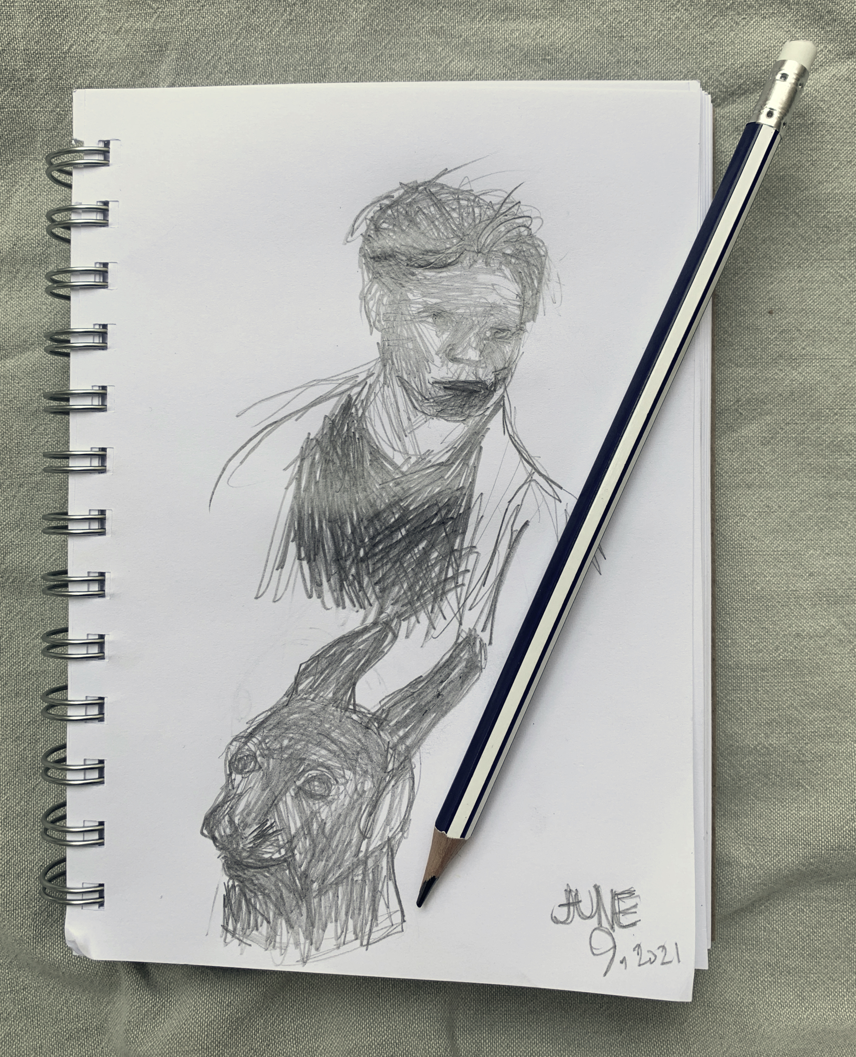 Page in a sketchbook with sketches of a human figure and a rabbit