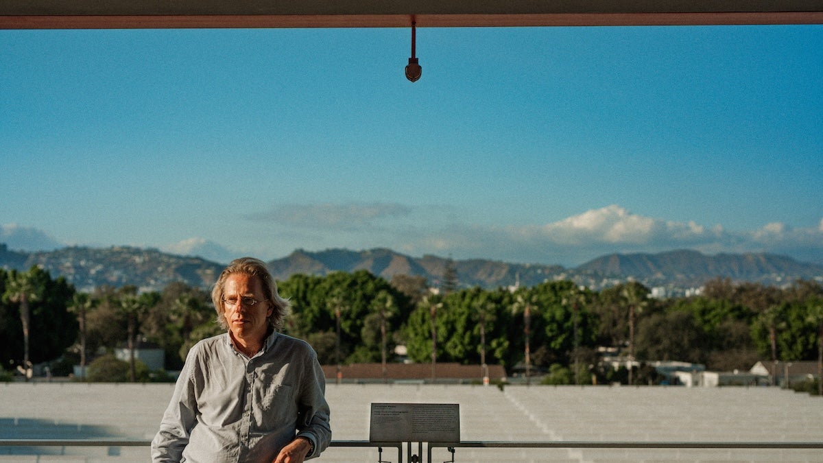 Jonathon Keats with Deep Time Cinematography, photo by Patrick Shen Jonathon Keats standing in front of Hollywood Hills landscape