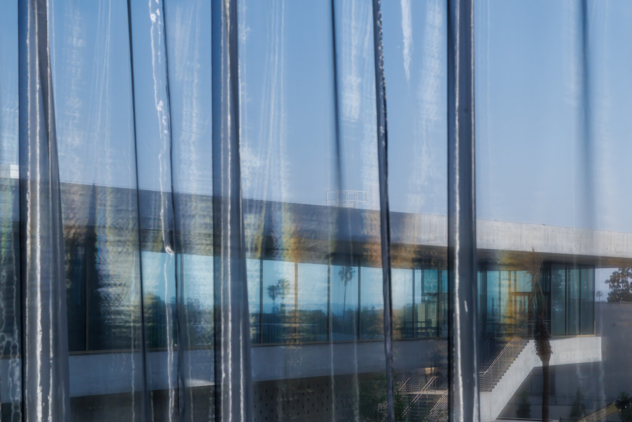 Reiko Sudō, Curtains: LACMA × NUNO Sputtered Chrome Matte (2025) and Curtains: LACMA × NUNO Sputtered Chrome Gloss (2026), Los Angeles County Museum of Art, commissioned by the Los Angeles County Museum of Art with funding provided by the Japanese Friends of LACMA, © NUNO Corporation, photo © Iwan Baan