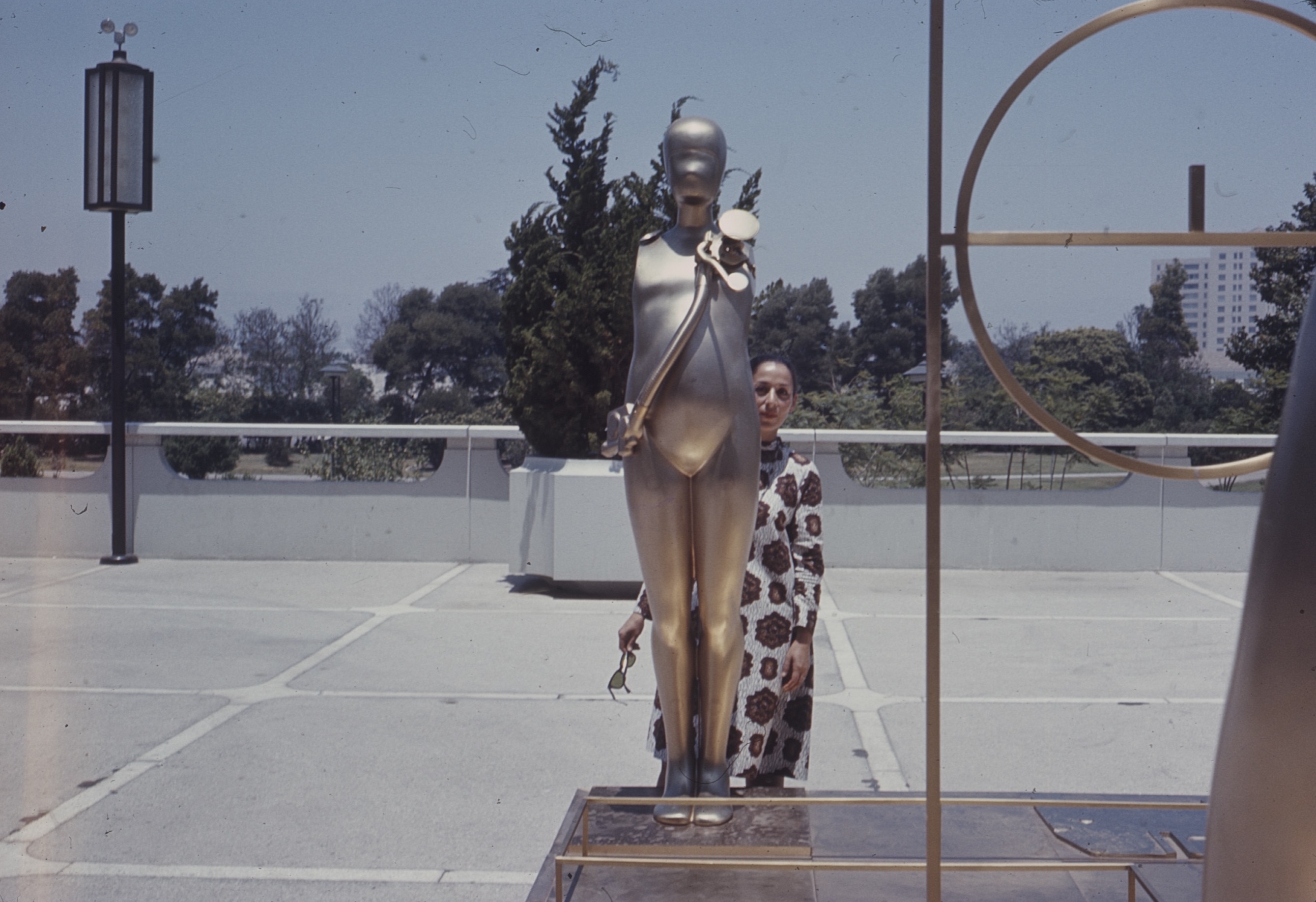 Luchita Hurtado on a visit to see American Sculpture of the Sixties at LACMA, 1967 (shown with a work by Ernest Trova), photo courtesy of the Hurtado studio