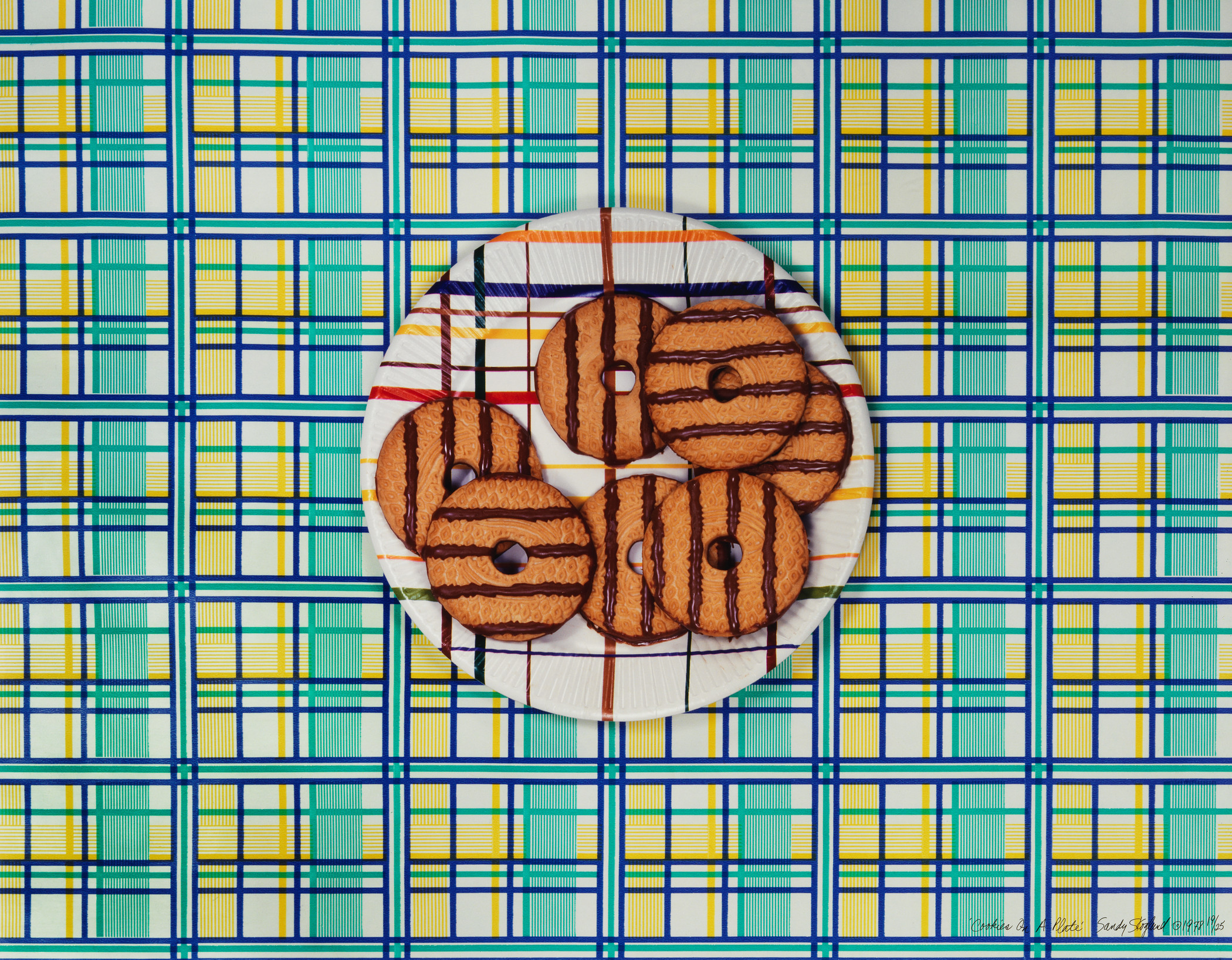 Striped cookies on a striped plate against striped background