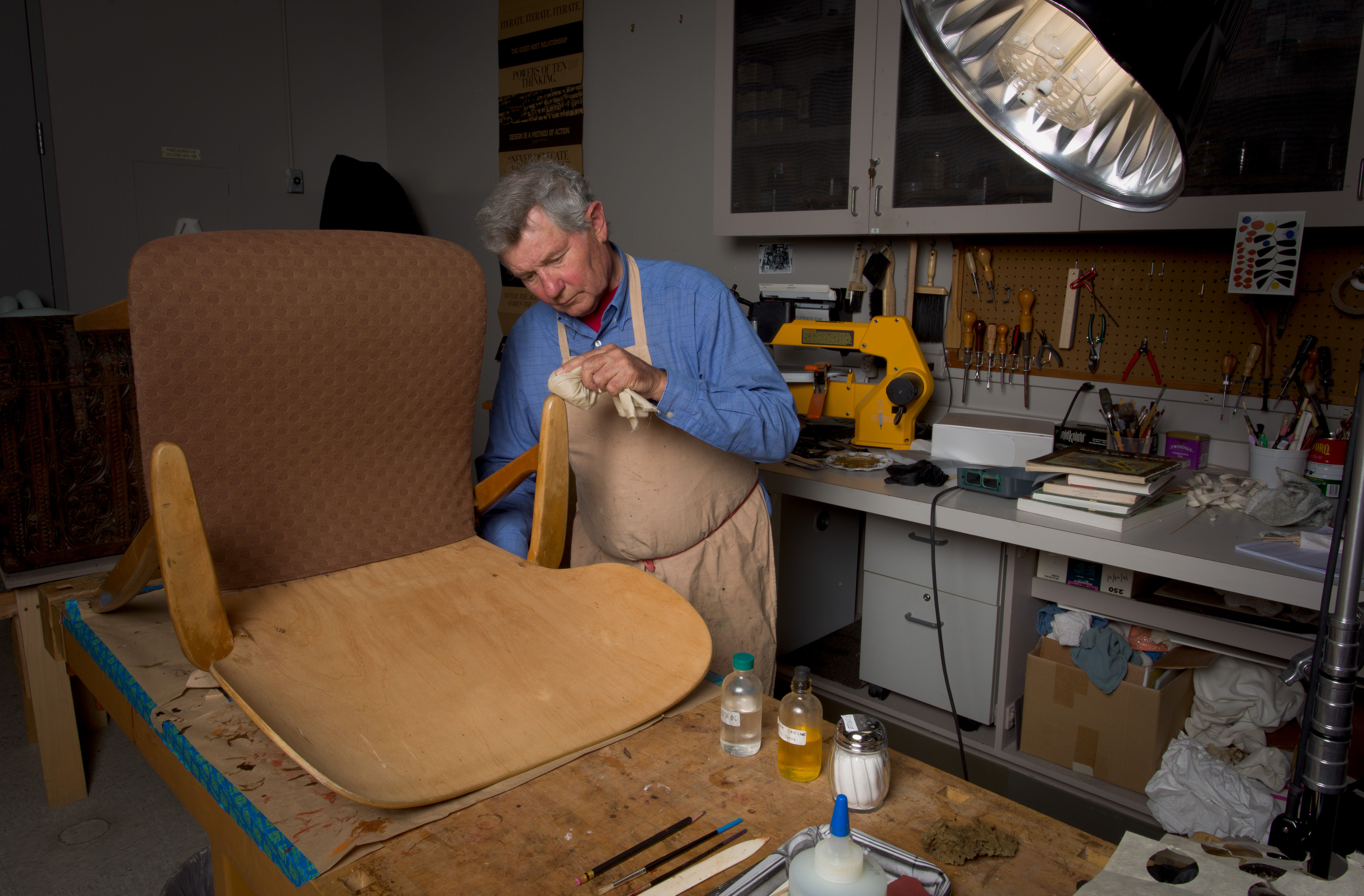 Don Menveg, Object Conservator, treating the Domus armchair frame, photo © Museum Associates/LACMA Conservation, by Yosi Pozeilov