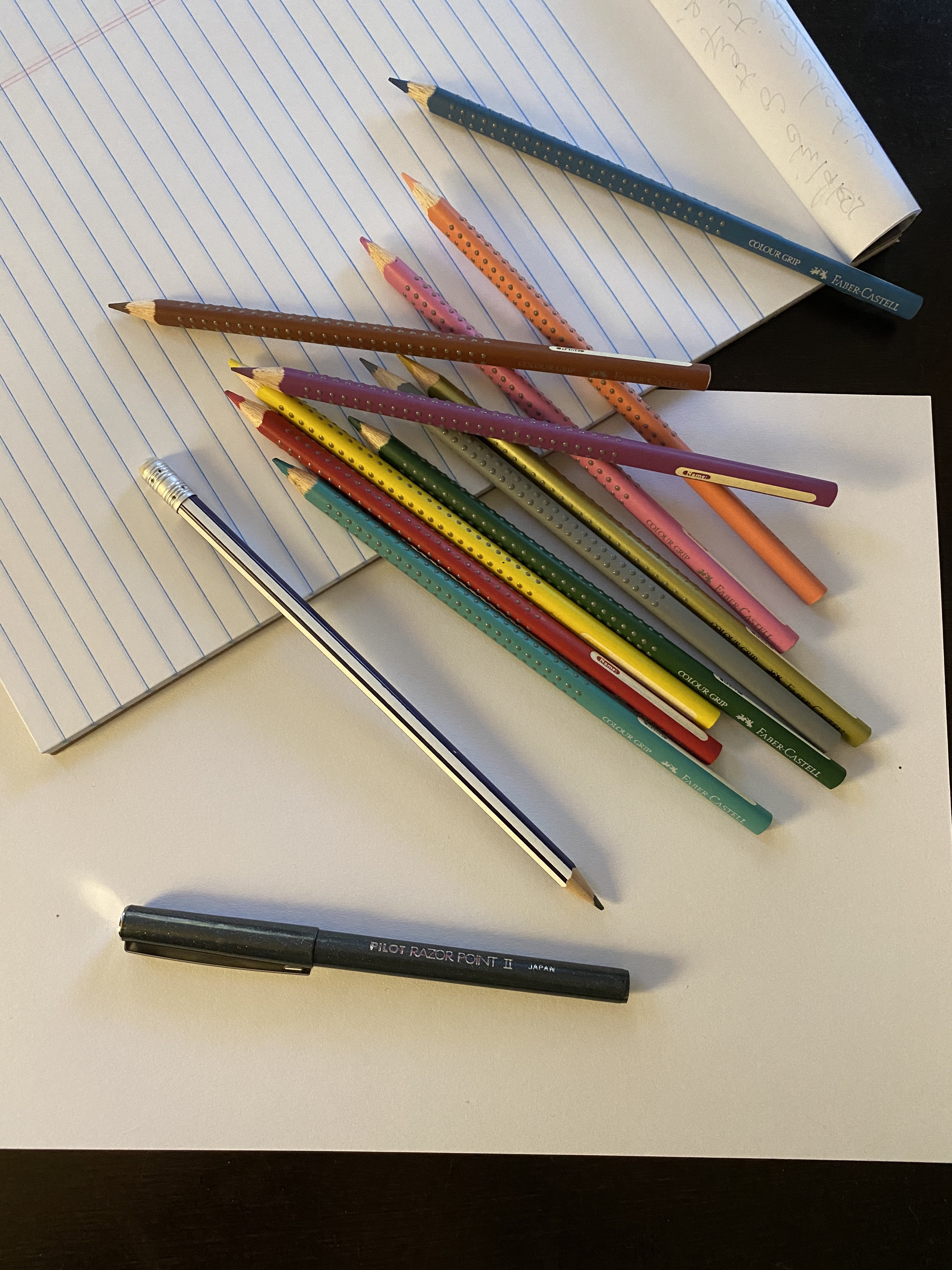 Pencils, pens on paper