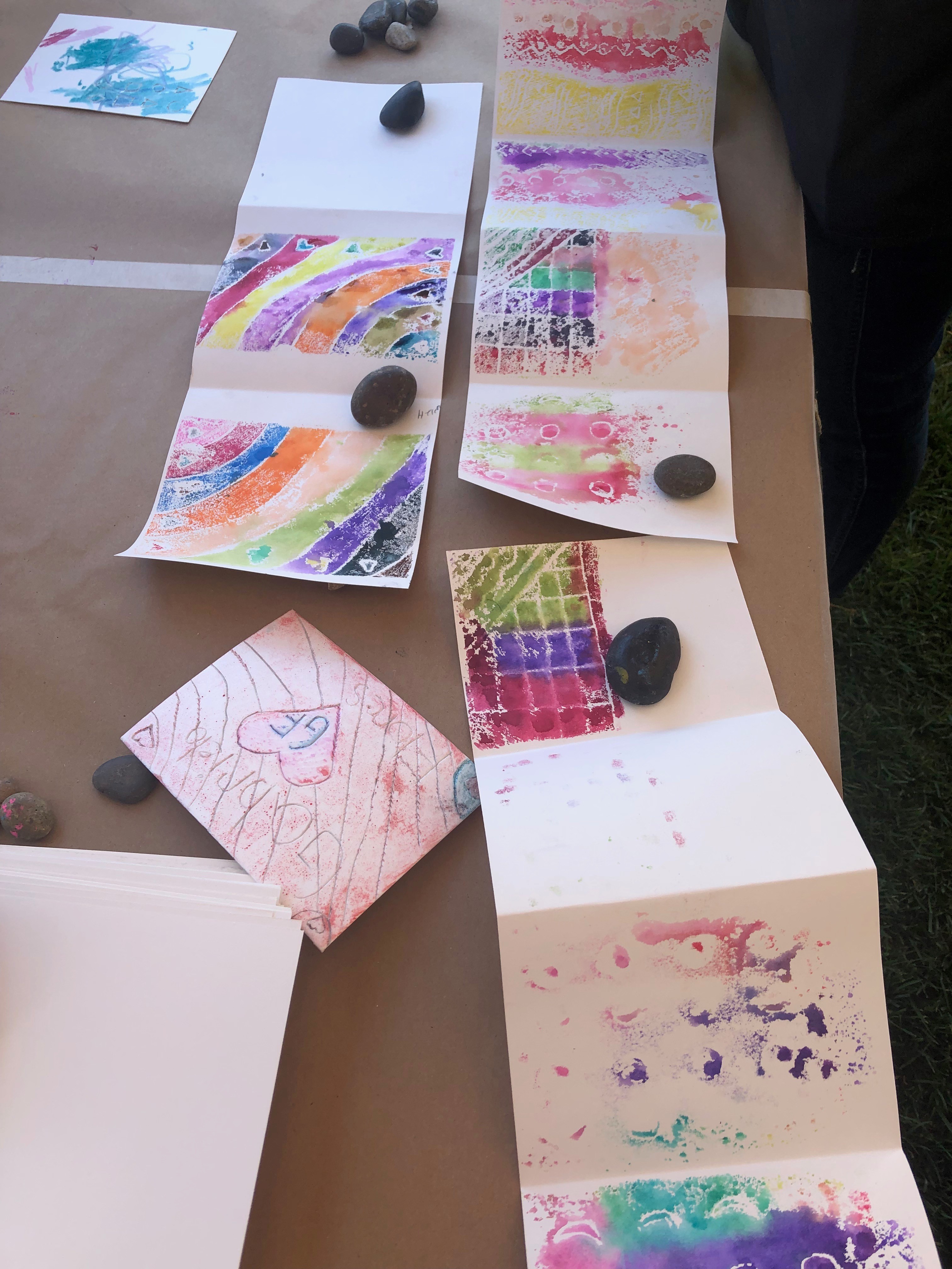 Families decorate art books at Andell Family Sundays