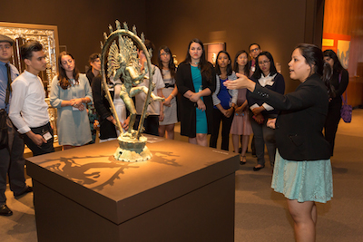The Andrew W. Mellon Summer Academy participant, Liliana Sanchez, presenting the sculpture, Shiva as the Lord of Dance to the rest of the group. Photo © Museum Associates/LACMA