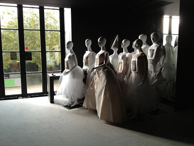 Unpacked and assembled mannequins wait to be dressed before installation