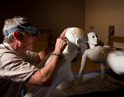 A member of the LACMA conservation team readies a mannequin for display. Reproduction Korova Milk Bar Mannequin, A Clockwork Orange, c. 2003, Replica: Cornelius Korff Breymann, Mutterschied, Wigs: Katy McClintock, Frankfurt am Main, Deutsches Filmmuseum, Frankfurt am Main, photo © 2012 Museum Associates/LACMA