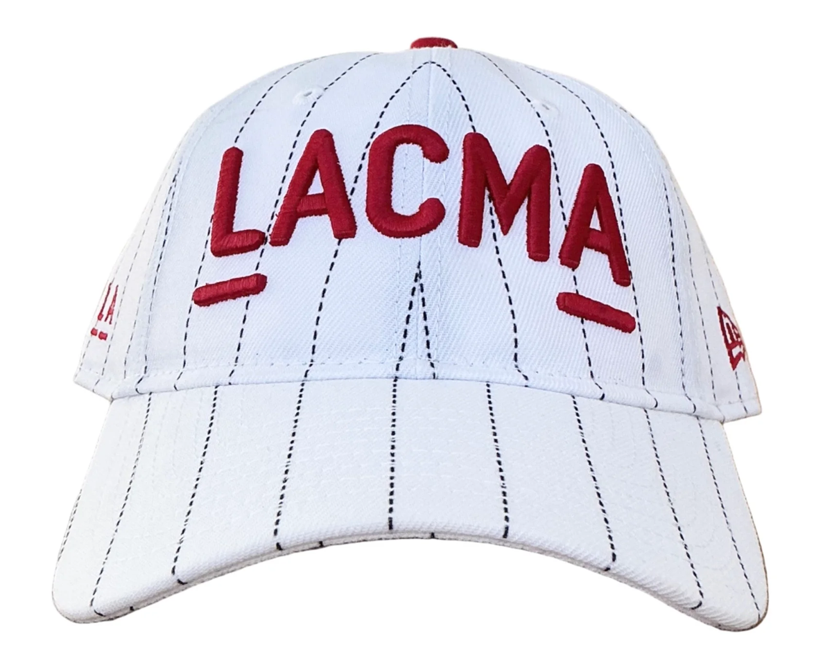 White baseball cap with black stripes and red LACMA logo