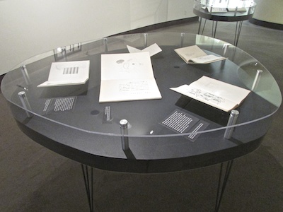 Oval tables custom made for the exhibition were inspired by Kitasono's aesthetic.