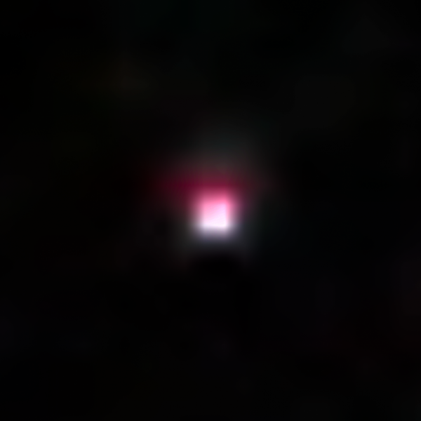 black image with square-shaped pink light in the center