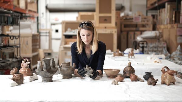 Julia Burtenshaw, LACMA's assistant curator for the Art of the Ancient Americas department studying Colombian artifacts from LACMA's collection. 