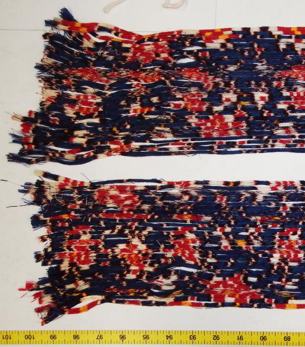 Warp ikat threads being examined by LACMA's Conservation team.