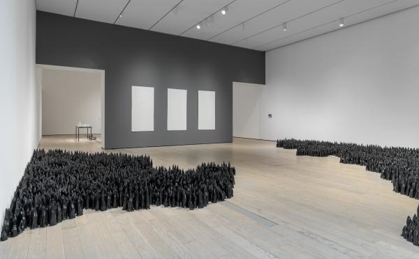 Installation photograph, featuring Liu Jianhua's Black Flame (2016–17) and Blank Paper (2009–12), in the exhibition The Allure of Matter: Material Art from China, at the Los Angeles County Museum of Art