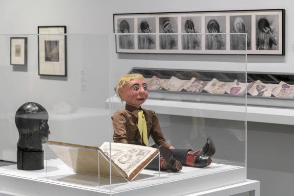 Installation photograph showing gallery view of the exhibition NOT I: Throwing Voices (1500 BCE–2020 CE), including a ventriloquist dummy in a display case