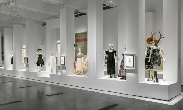 Gallery with dressed mannequins and other art
