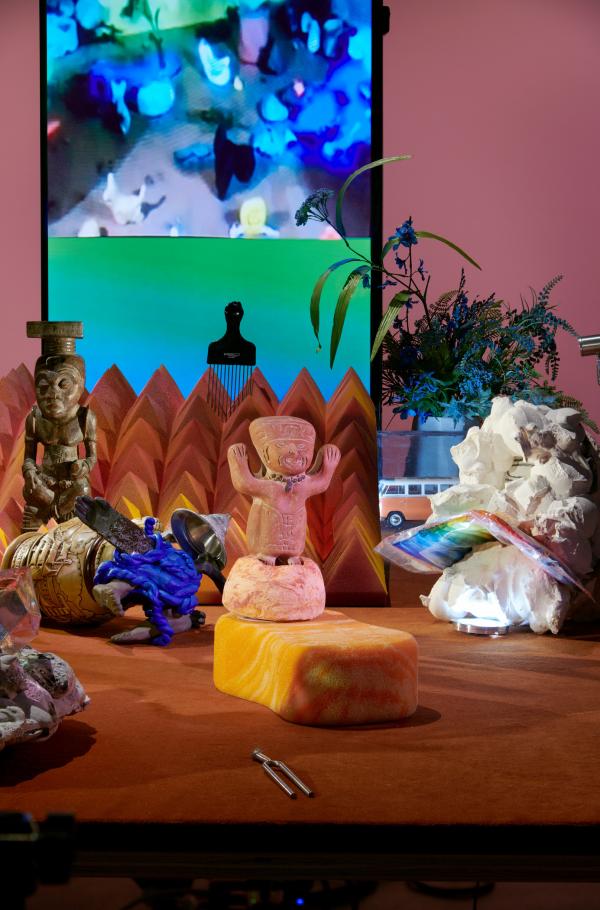 Diorama with sculptures, objects, and video