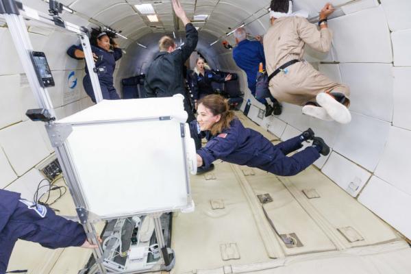Astronauts floating in space station