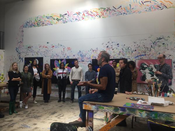 Avant-Garde members attending a studio visit with artist Kenny Scharf