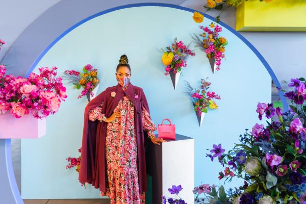 Woman posing in floral installation