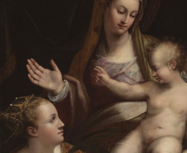 A woman and two children, and a man standing behind them