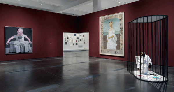Gallery view with sculpture and paintings