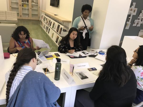 The 2019 Mellon Summer Academy students: Jenebrith Pastran, Emily Le, JaBrea Patterson-West (advisor), Melissa San Miguel, Victoria Vargas, and Eavan McNeil discussing their selected photographs