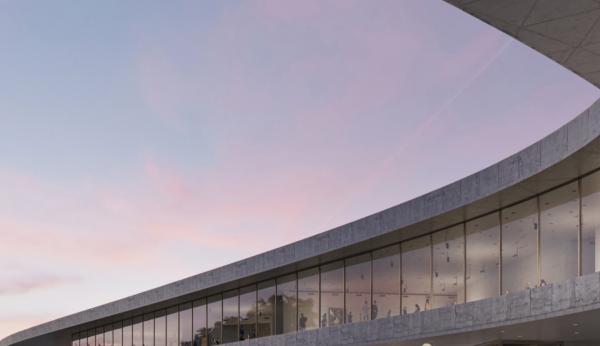 Rendering of a portion of the exterior of gray building with tall windows against the sunset