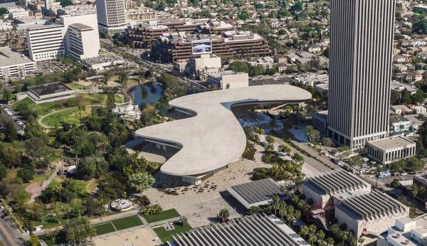 Aerial view of pale, organically shaped building crossing Wilshire Boulevard