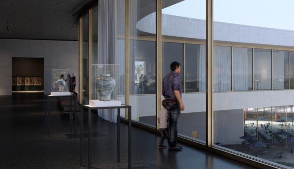 An adult and child look out floor-to-ceiling windows of museum gallery with art