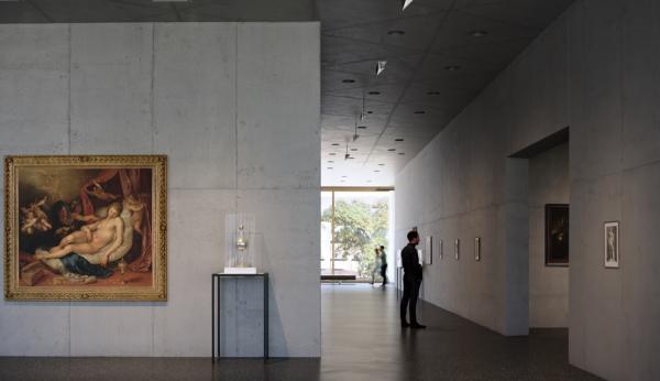 Rendering of gallery with art and visitor