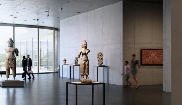 Interior view of gallery with sculptures and visitors