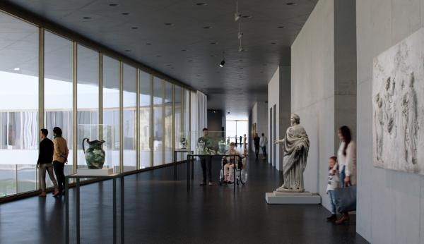 Gallery view with sculptures and floor-to-ceiling windows