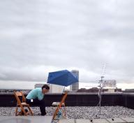 Kata Kovács tracking satellite signals on the roof at LACMA, August 2017, © Kovács/O’Doherty