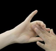 image of hands against a black background
